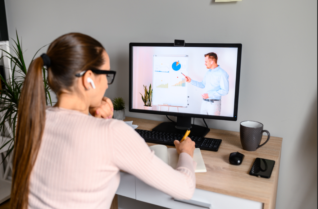 woman watching presentation on computer