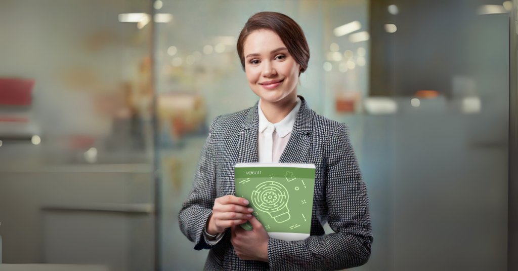 Image of a female employee holding a leveraging neurodiversity training guide.