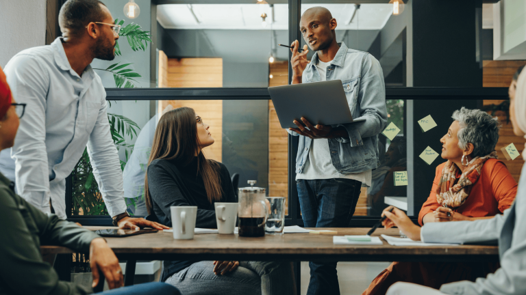 Adaptive leadership in a vuca world featuring a leader interacting with employees