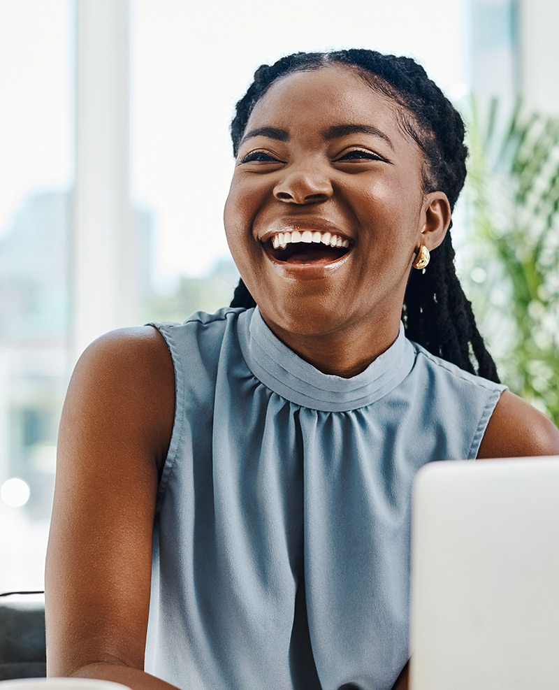 Women laughing and having fun while using LMS