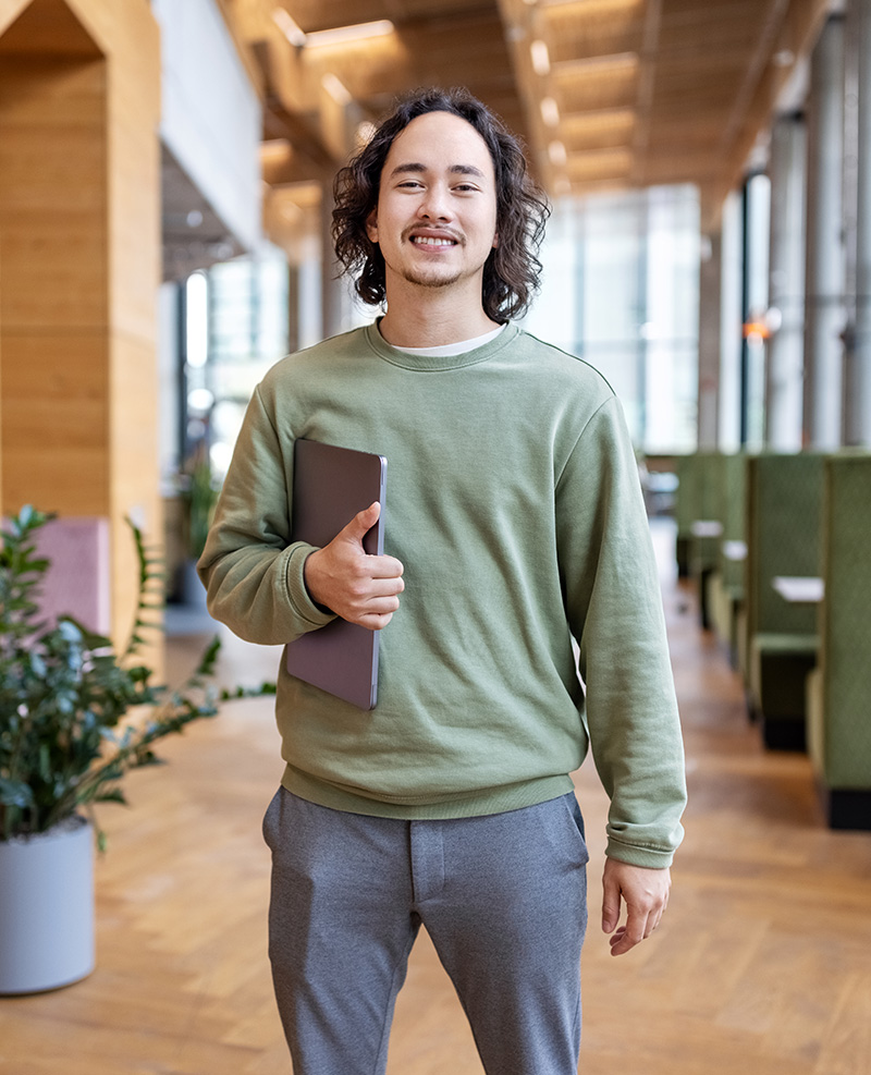 Man holding laptop computer