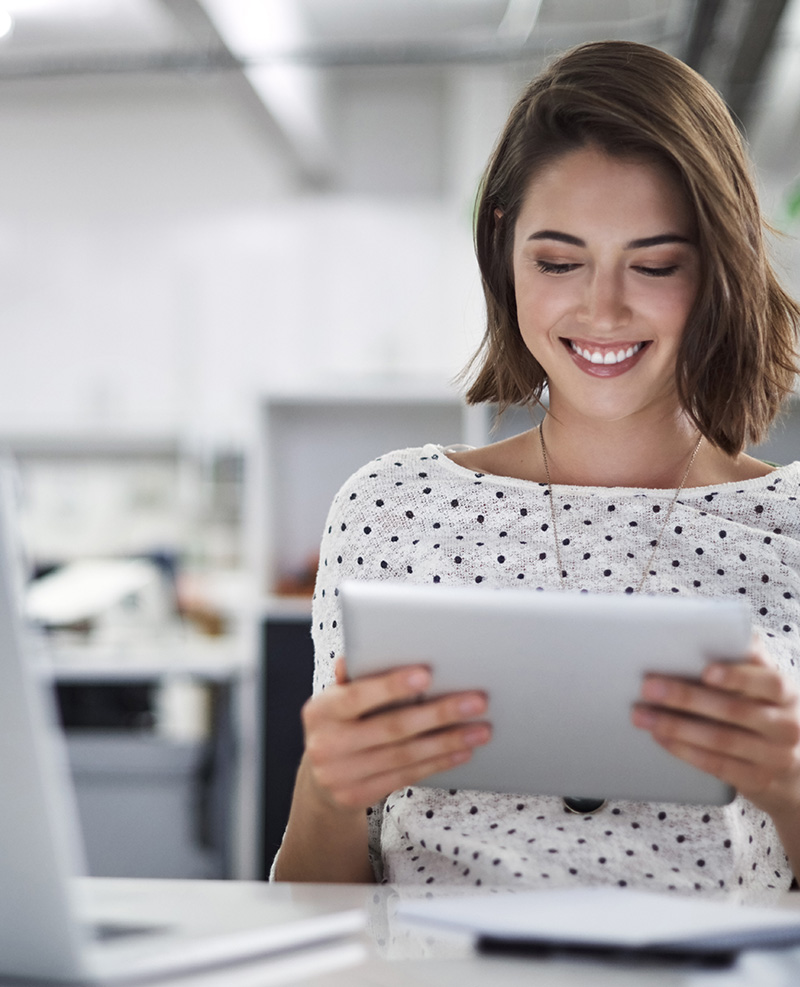 Woman reading off of an iPad