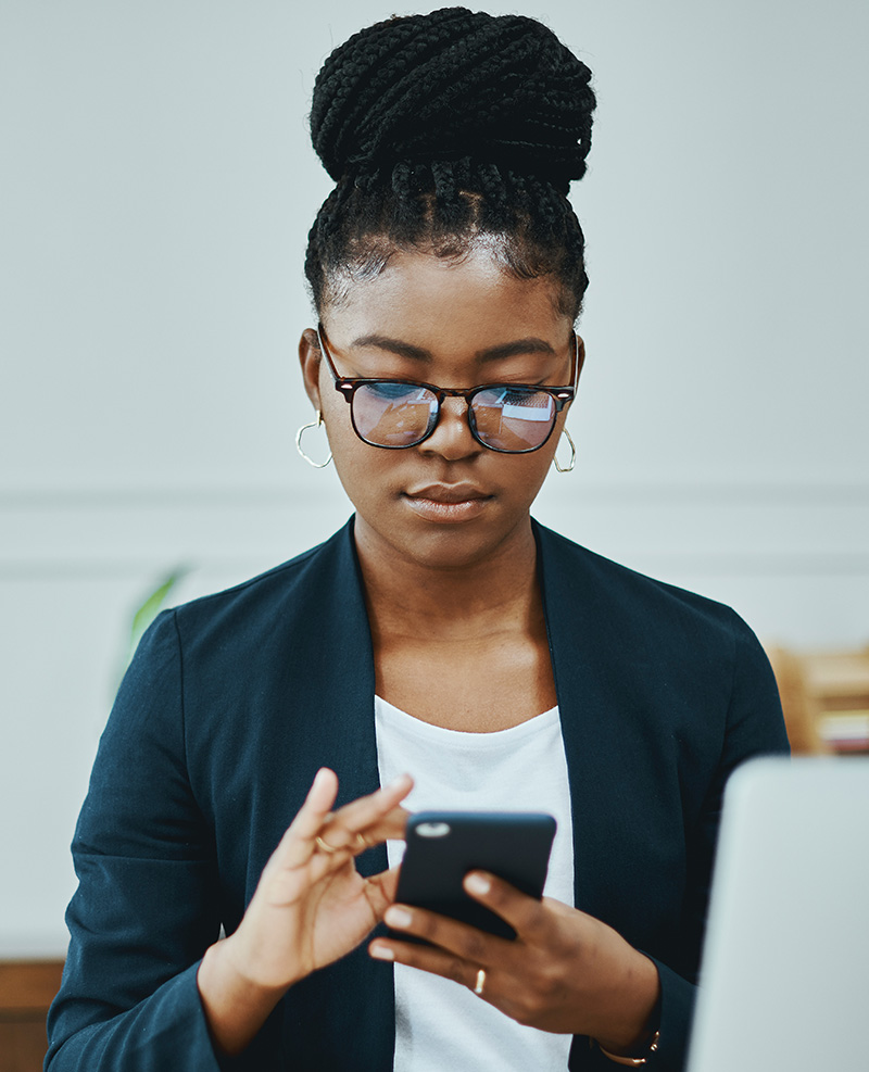 Woman using iPhone to edit courseware